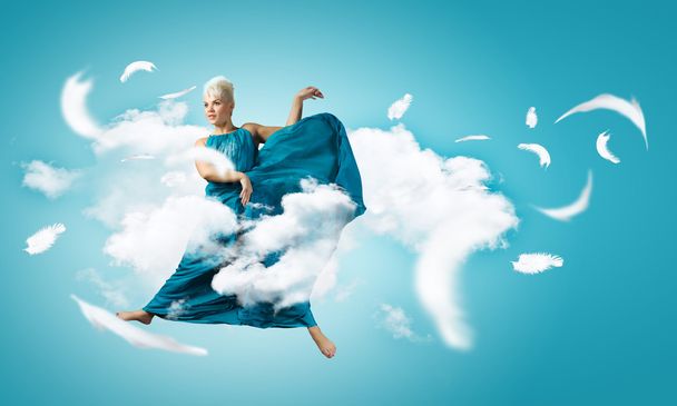 Carefree woman jumping high - Foto, Imagen