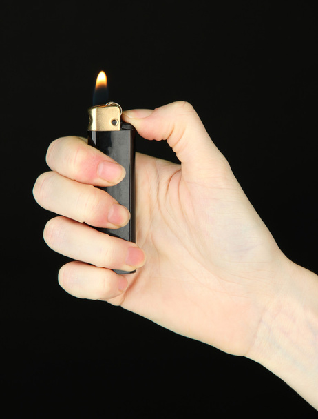 Burning lighter in female hand - Zdjęcie, obraz