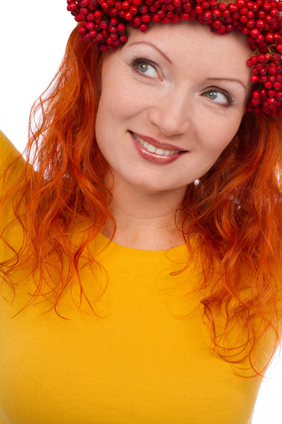 Woman with red berries on head - Foto, Bild