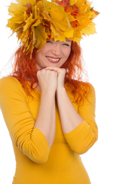 Woman with yellow leaves on her head - Φωτογραφία, εικόνα