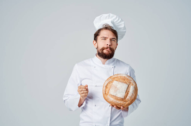 bearded man chef with bread. High quality photo - Photo, Image