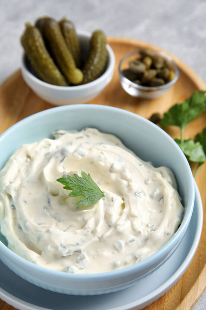 Tasty tartar sauce and ingredients on table, closeup - Photo, image