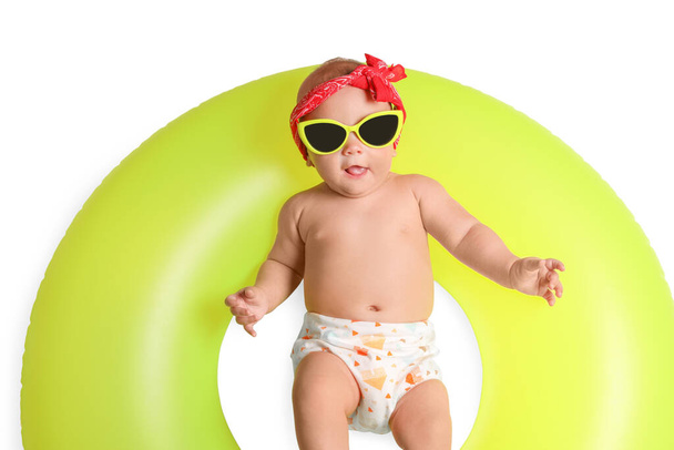 Cute little baby in sunglasses with inflatable ring on white background, top view - Foto, Bild
