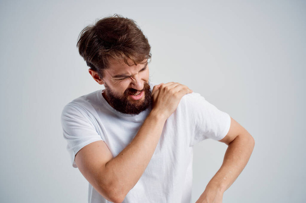 man with backache in studio, treatment. High quality photo - Photo, Image