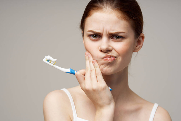 pretty woman in white t-shirt dental hygiene health care studio lifestyle - Photo, image