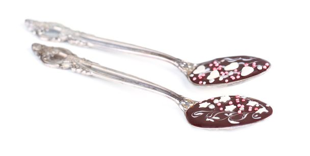 Spoons with tasty chocolate for party. Isolated on white - Valokuva, kuva