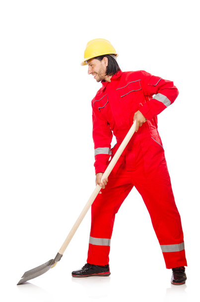 Piros overálos férfi ásóval - Fotó, kép