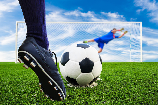Foot shooting soccer ball to goal - Foto, imagen