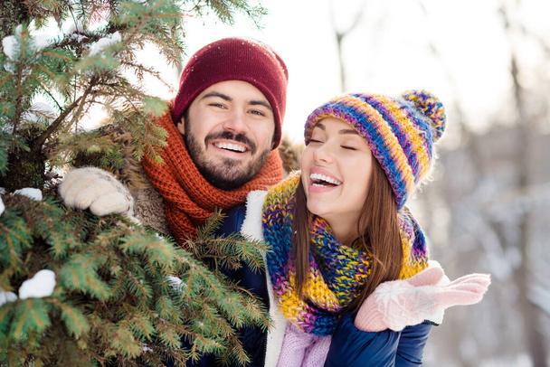 Photo of young excited couple happy positive smile have fun enjoy time together winter snow forest woods - Valokuva, kuva
