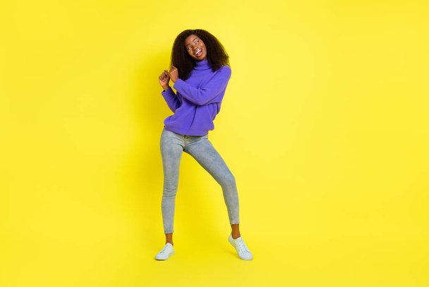 Full body portrait of carefree positive dark skin girl partying have fun isolated on yellow color background - Foto, Imagem