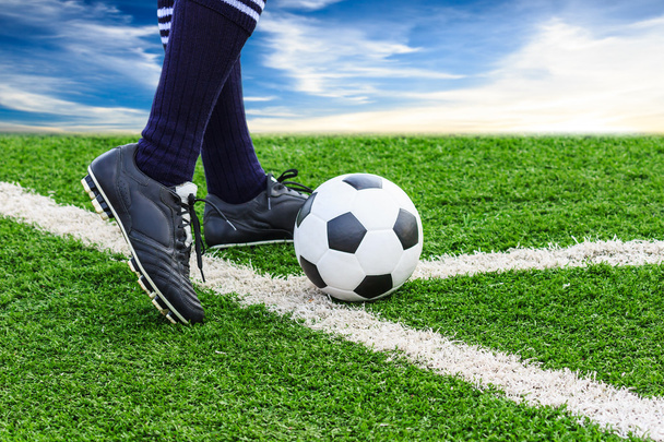 Foot kicking soccer ball - Valokuva, kuva