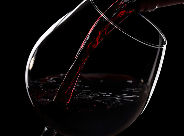 Pouring red wine - Фото, зображення