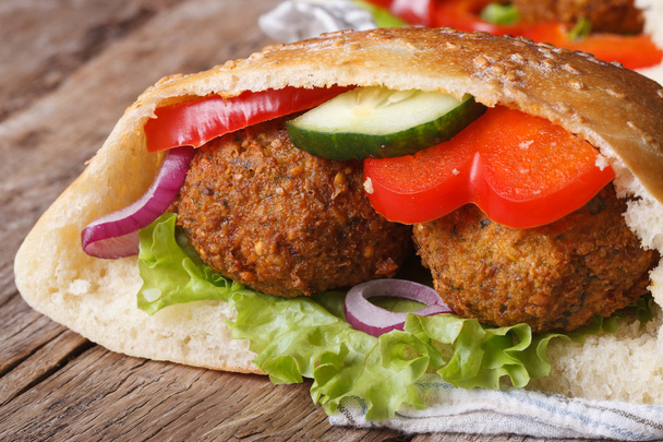 falafel with fresh vegetables in pita bread close-up - Photo, Image