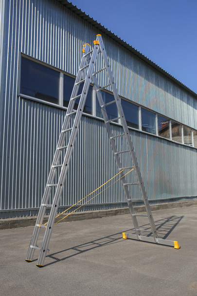 step-ladder at warehouse wall - Fotografie, Obrázek