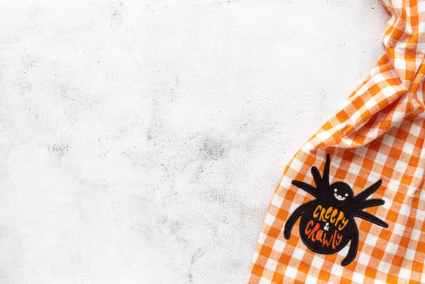 Checked tablecloth with Halloween picture on grey background - Foto, afbeelding