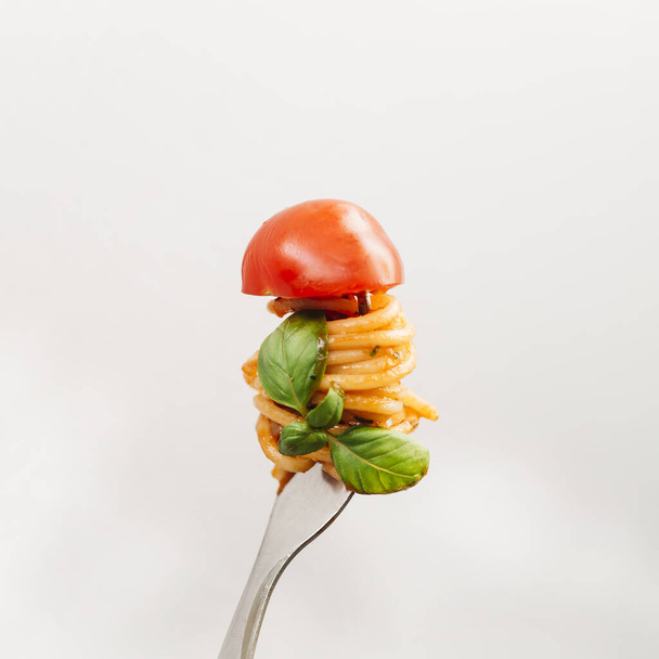 tasty spaghetti wrapped around fork. High quality beautiful photo concept - Photo, Image