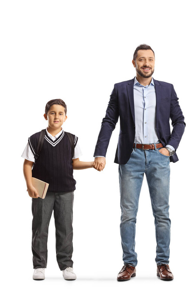 Full length portrait of father and son holding hands isolated on white background - Foto, Imagem