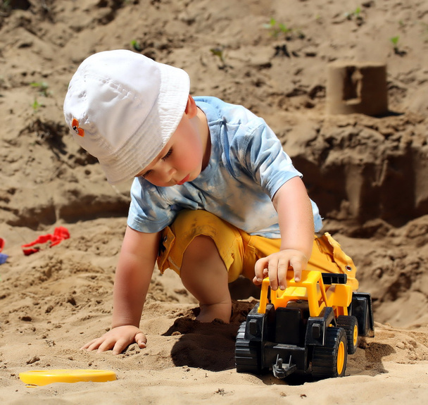 Little child play with sand - Photo, Image