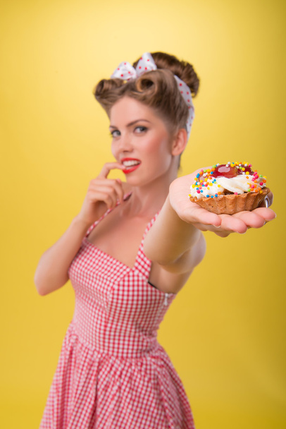 Beautiful emotional girl with pretty smile in pin-up style posin - Photo, image