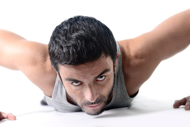Attractive sport man training push up exercise isolated on white - Fotoğraf, Görsel
