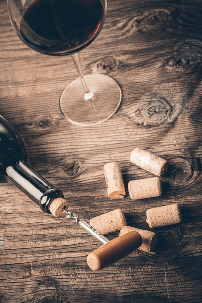 Bottle of wine with corkscrew - Photo, image