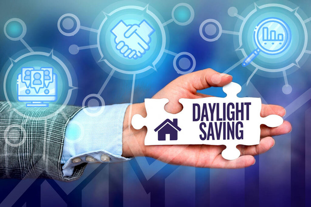 Handwriting text Daylight Saving. Business showcase Storage technologies that can be used to protect data Hand Holding Jigsaw Puzzle Piece Unlocking New Futuristic Technologies. - Photo, Image