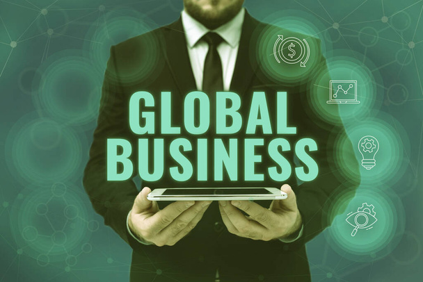 Inspiration showing sign Global Business. Word Written on Trade and business system a company doing across the world Man In Office Uniform Holding Tablet Displaying New Modern Technology. - Photo, Image