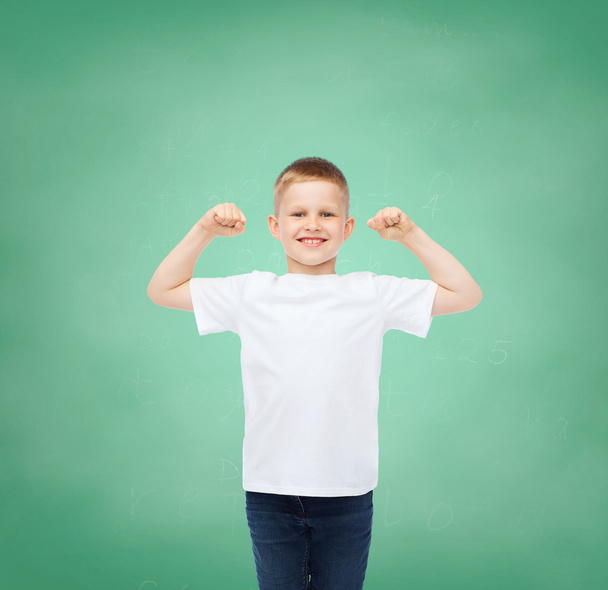 little boy in white t-shirt with raised hands - Фото, изображение