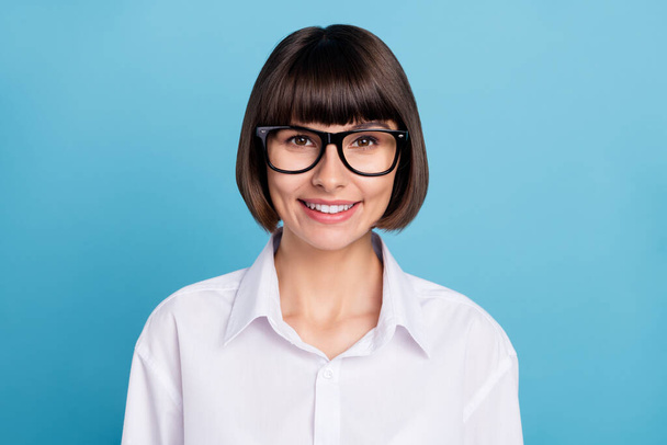 Portrait of attractive cheerful content skilled experienced girl specialist expert isolated over bright blue color background - Fotografie, Obrázek