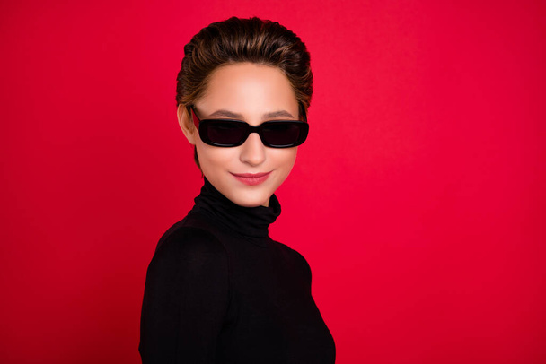 Profile side photo of young woman happy positive smile wear eyeglasses isolated over red color background - Фото, изображение