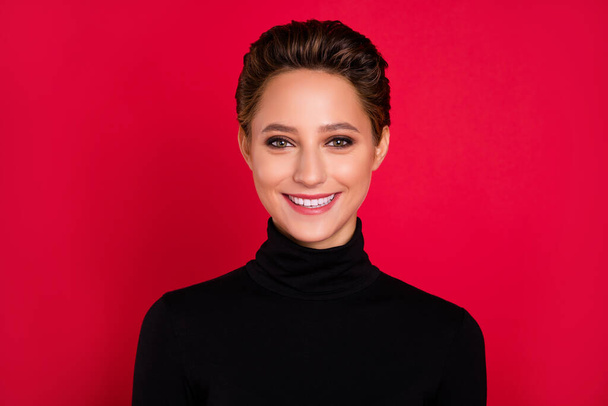 Photo of young happy positive charming woman smile good mood wear turtleneck isolated on red color background - 写真・画像