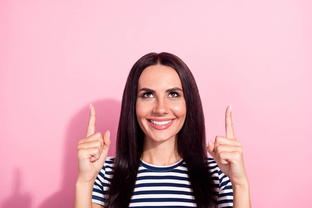 Portrait of attractive cheerful woman showing demonstrating up ad solution decision isolated over pink pastel color background - Fotó, kép