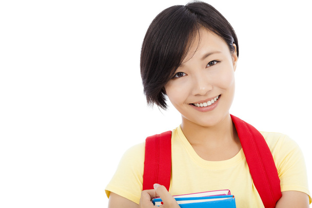 Close-up van glimlachen student meisje op witte achtergrond - Foto, afbeelding