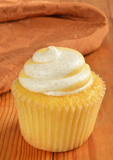 A cupcake with peach filling - Photo, Image