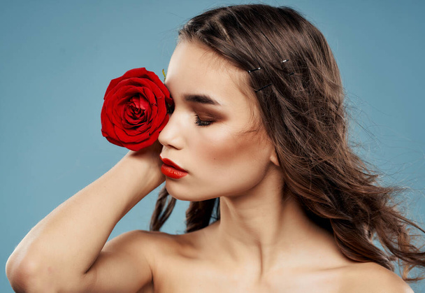 woman bright makeup rose in hand luxury blue background - Photo, Image