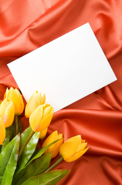 Envelope and flowers on the satin background - Valokuva, kuva