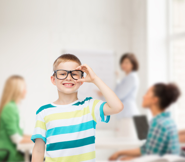 smiling little boy in eyeglasses - Foto, afbeelding