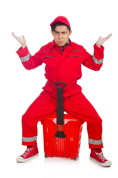 Férfi piros overallban bevásárlókocsival - Fotó, kép