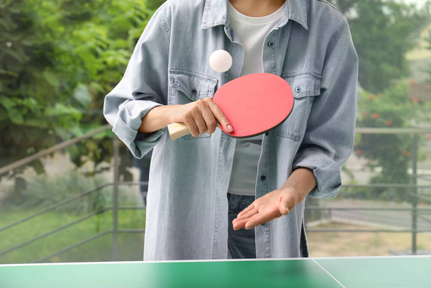 Woman playing ping pong indoors, closeup view - 写真・画像