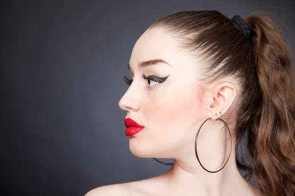 Portrait of girl with red lips and black eyeliner - Φωτογραφία, εικόνα