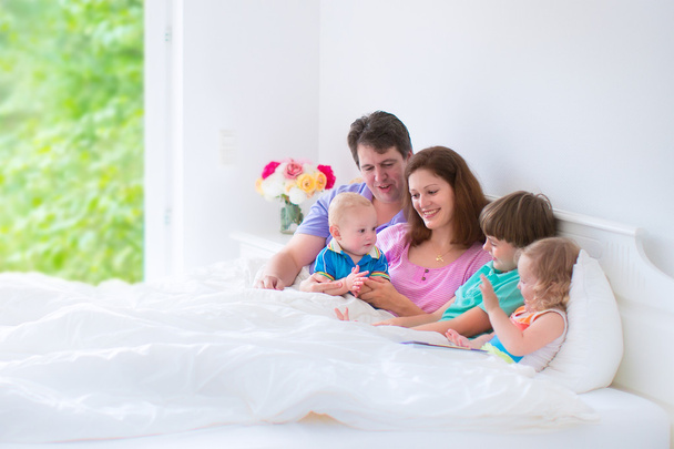 Happy big family in a bed - Photo, image