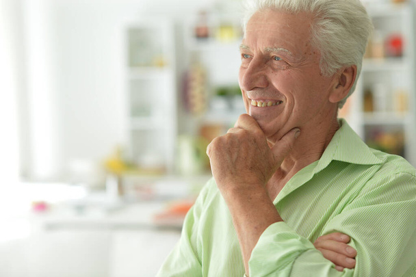 portrait of senior man smiling at home  - Foto, imagen