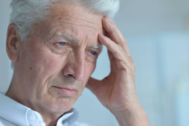 Portrait of a sad senior man thinking  - Фото, изображение
