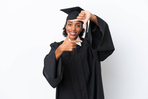 Young university graduate African American woman isolated on white background focusing face. Framing symbol - Photo, image