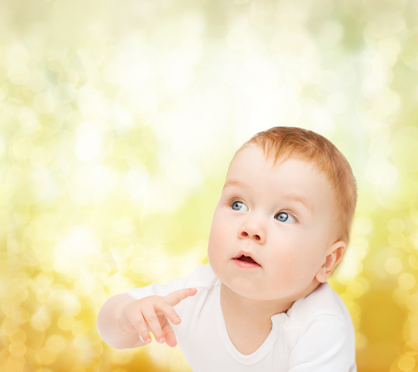 curious baby looking side - Photo, Image