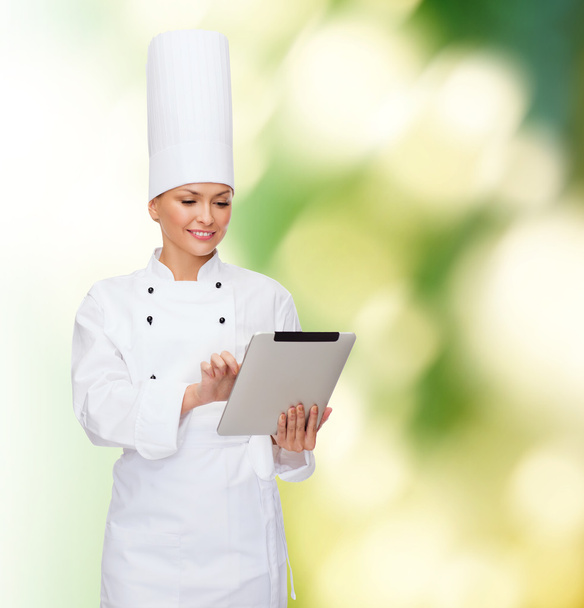 smiling female chef with tablet pc computer - Φωτογραφία, εικόνα