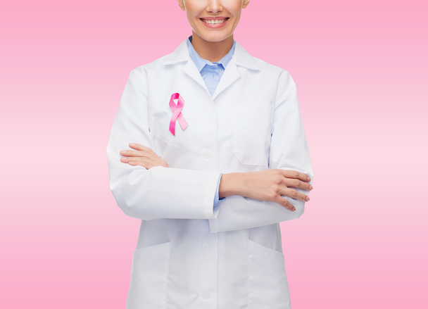 close up of doctor with cancer awareness ribbon - Photo, image