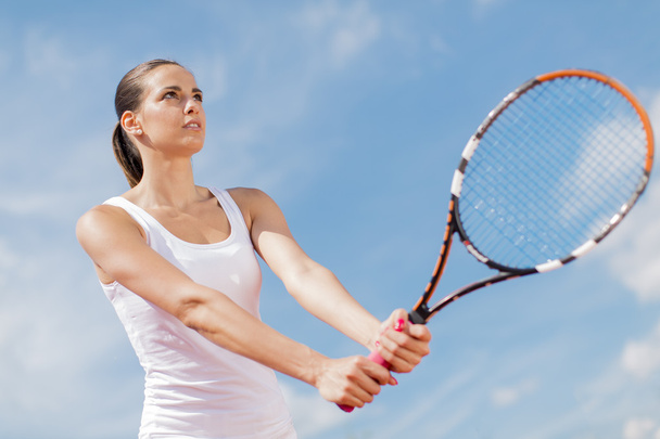 Young woman playing tennis - Photo, image