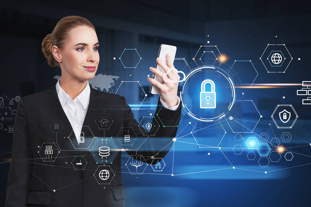 Attractive businesswoman holding smartphone and looking into the touch screen, blue glowing information protection icons. Padlock, cloud and digital interface. Concept of cyber security. - Fotó, kép