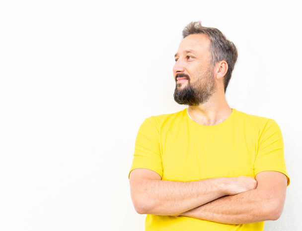 One positive man with yellow shirt portrait - Fotografie, Obrázek